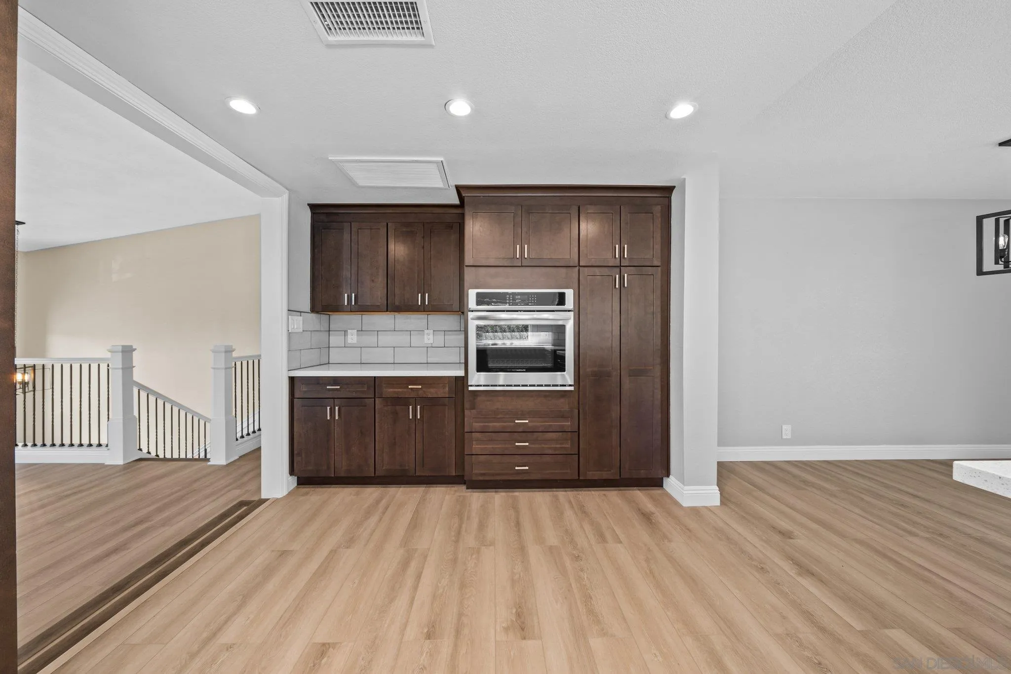 31241 Old River Road Bonsall, CA 92003 - Photo 8 of 51 a kitchen with stainless steel appliances kitchen island granite countertop a refrigerator and a stove top oven