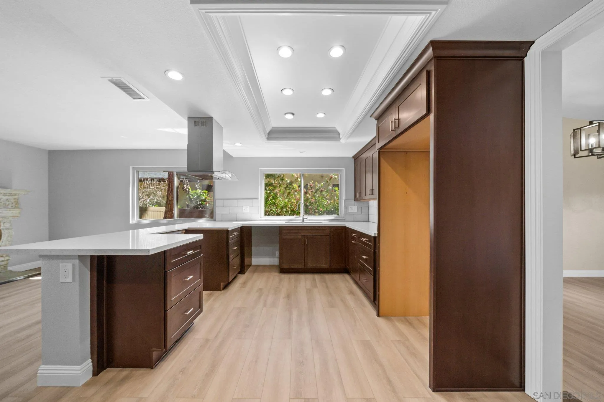 31241 Old River Road Bonsall, CA 92003 - Photo 10 of 51 a large kitchen with a large window and stainless steel appliances