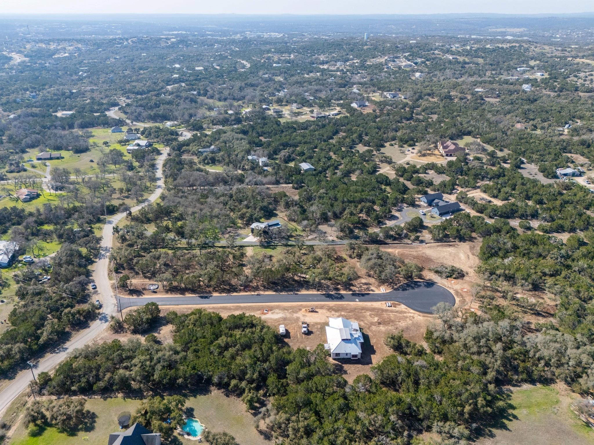 Lot-5 Lot-5 Spring Dripping Springs, TX 78620 - Photo 6 of 9 an aerial view of residential houses with city and green space