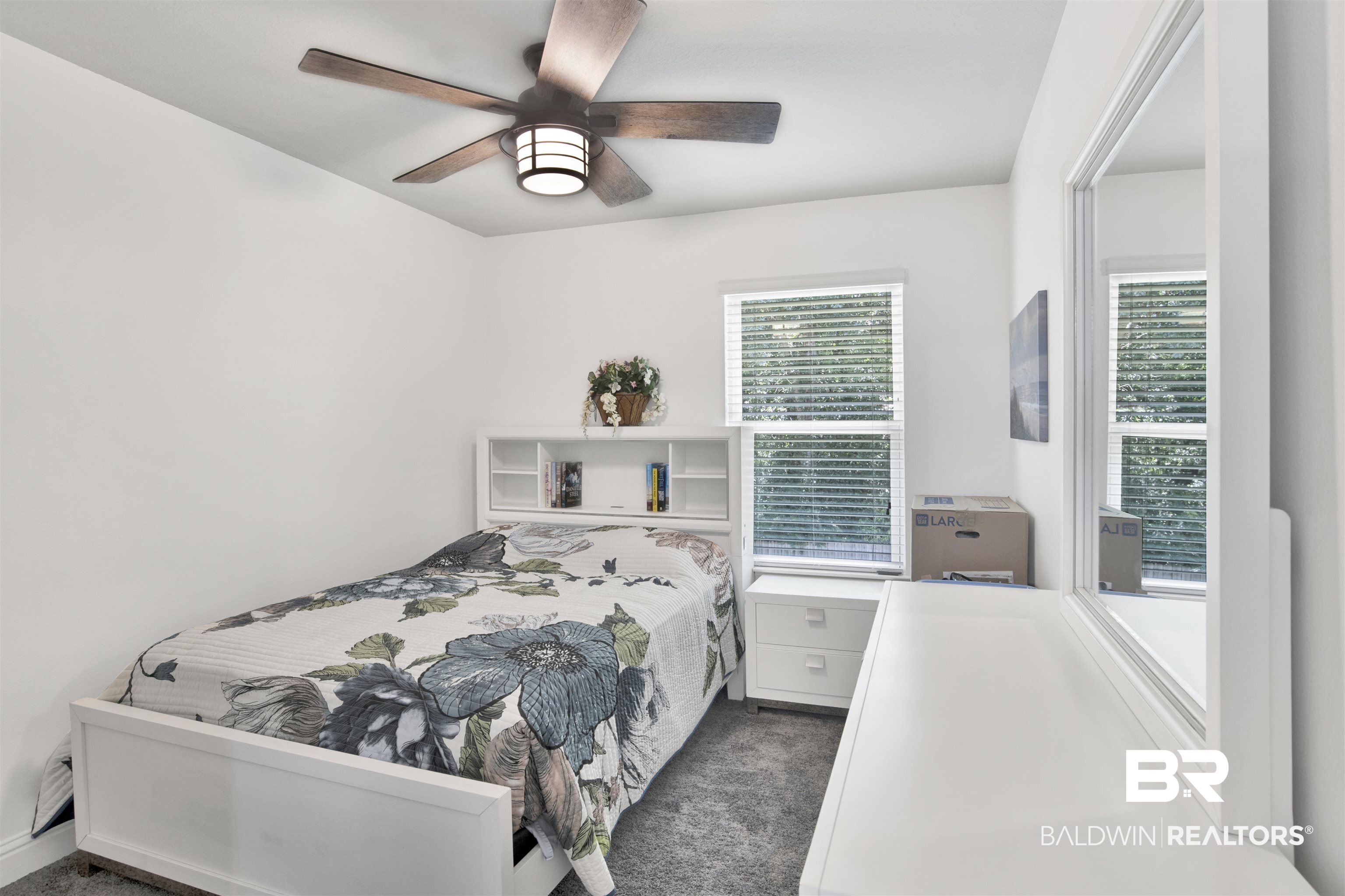 25806 Pollard Road, Unit 20 Daphne, AL 36526 - Photo 18 of 29 Carpeted bedroom with multiple windows and ceiling fan