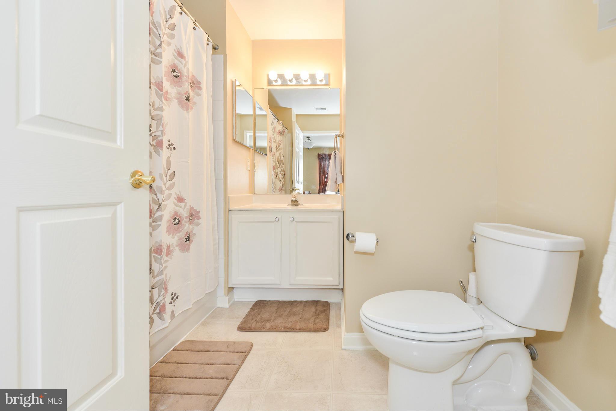 511 Constellation Square Southeast, Unit A Leesburg, VA 20175 - Photo 14 of 27 a bathroom with a toilet and a shower