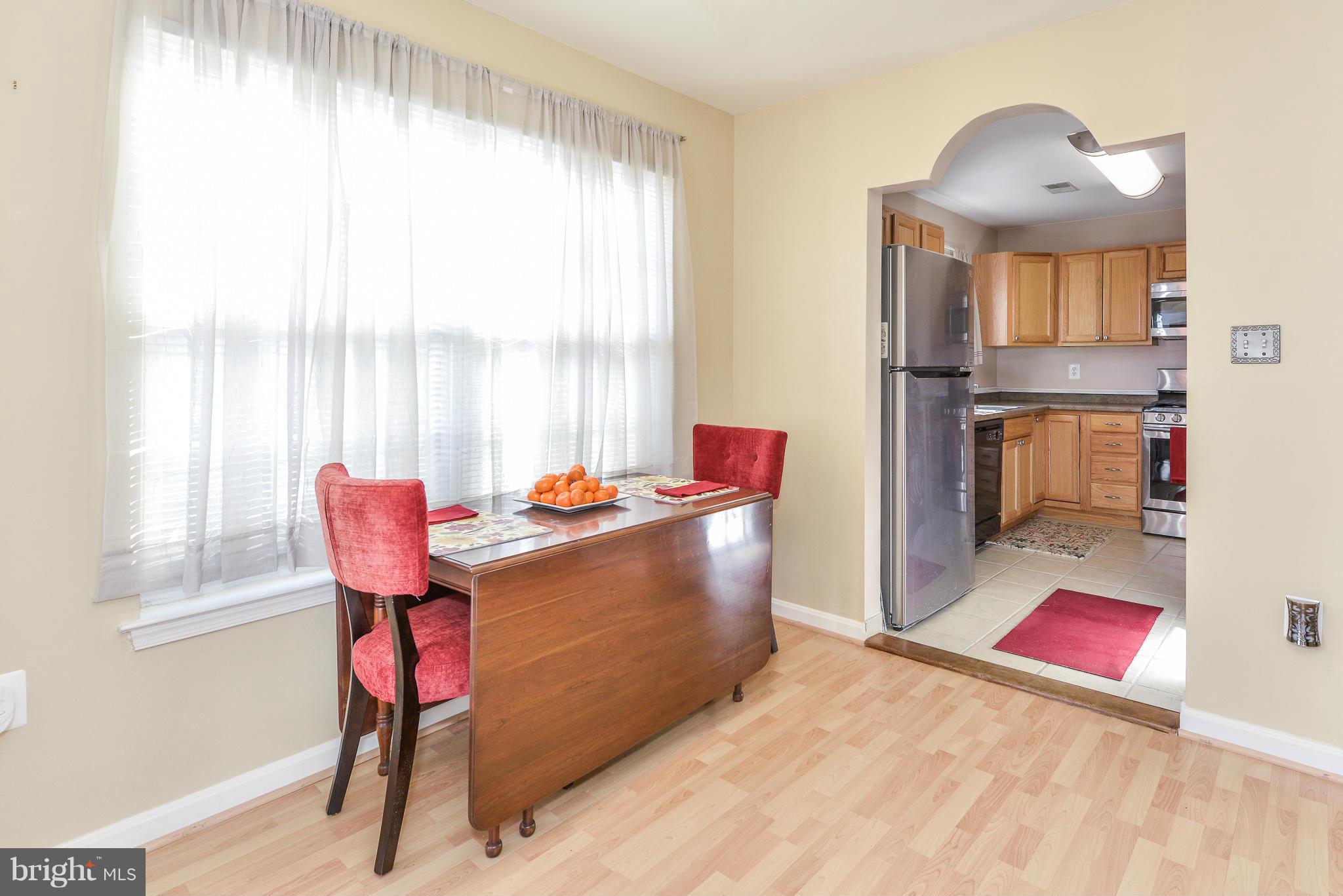 511 Constellation Square Southeast, Unit A Leesburg, VA 20175 - Photo 6 of 27 a living room with a couch and a table