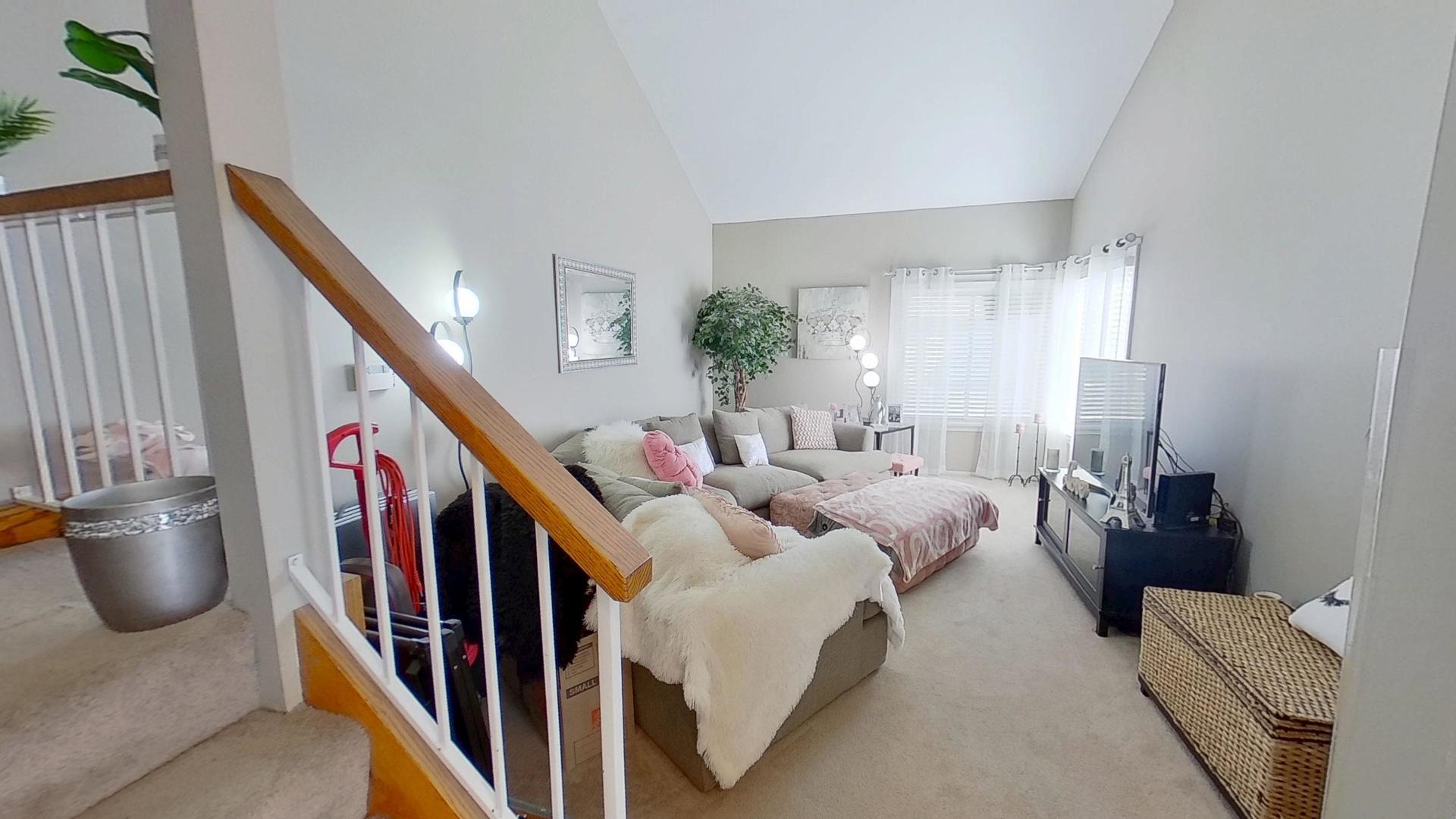 772 Colorado Court, Unit 772 Carol Stream, IL 60188 - Photo 13 of 26 a living room with furniture and stairs
