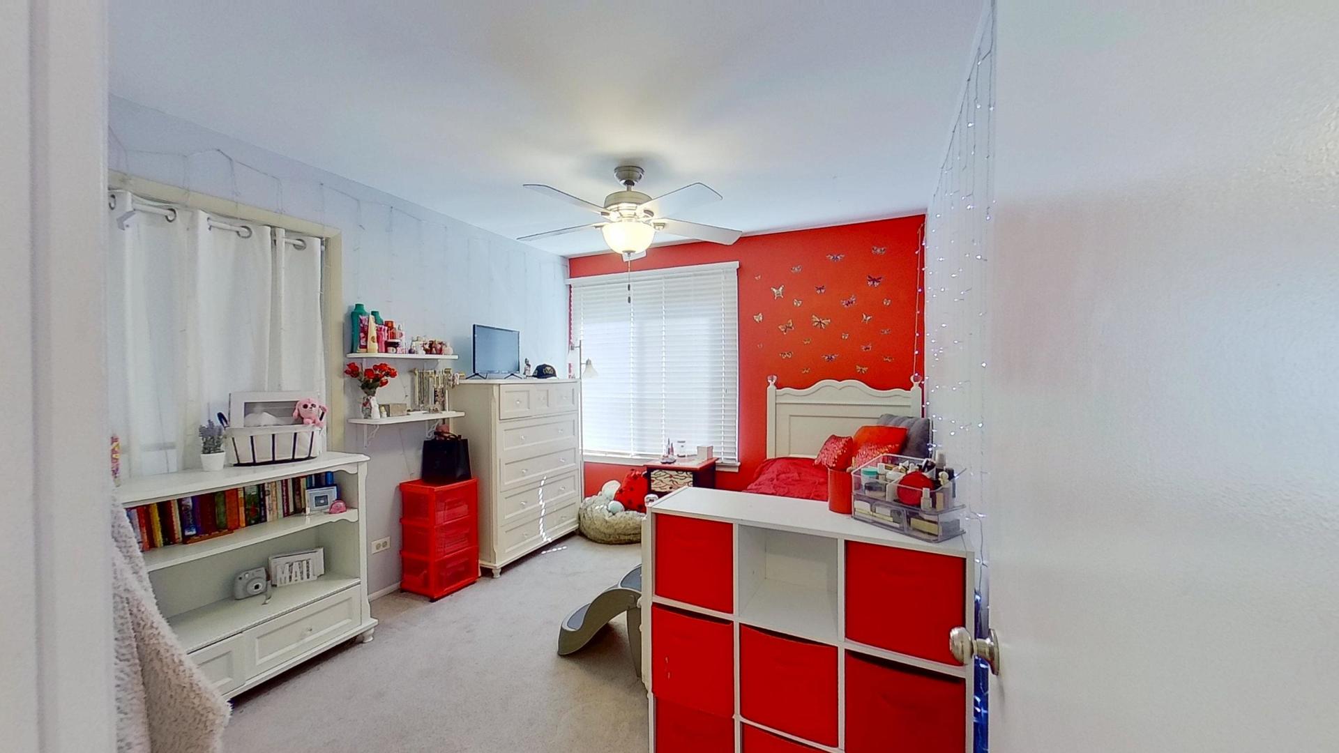 772 Colorado Court, Unit 772 Carol Stream, IL 60188 - Photo 20 of 26 a room with toys and white walls