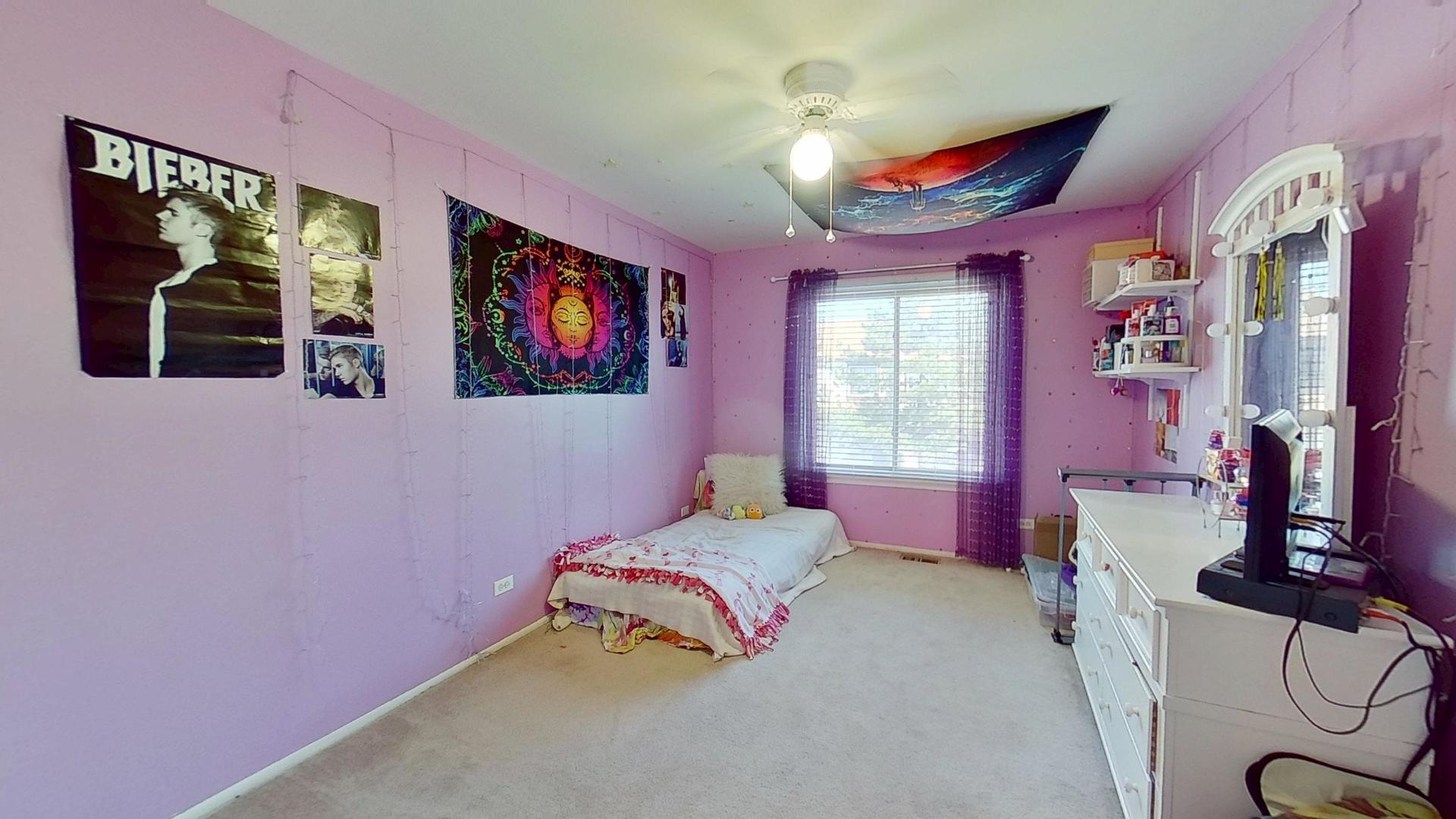 772 Colorado Court, Unit 772 Carol Stream, IL 60188 - Photo 21 of 26 a bedroom with a bed and a painting on the wall