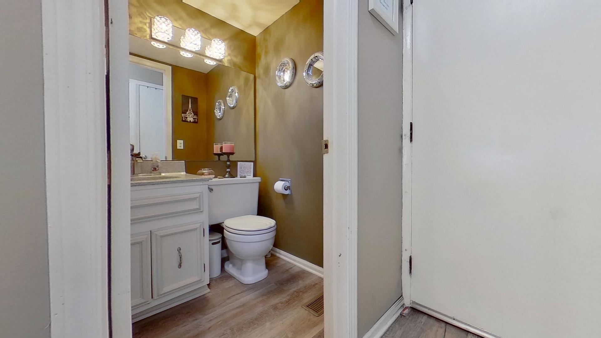 772 Colorado Court, Unit 772 Carol Stream, IL 60188 - Photo 23 of 26 a bathroom with a toilet sink and a mirror