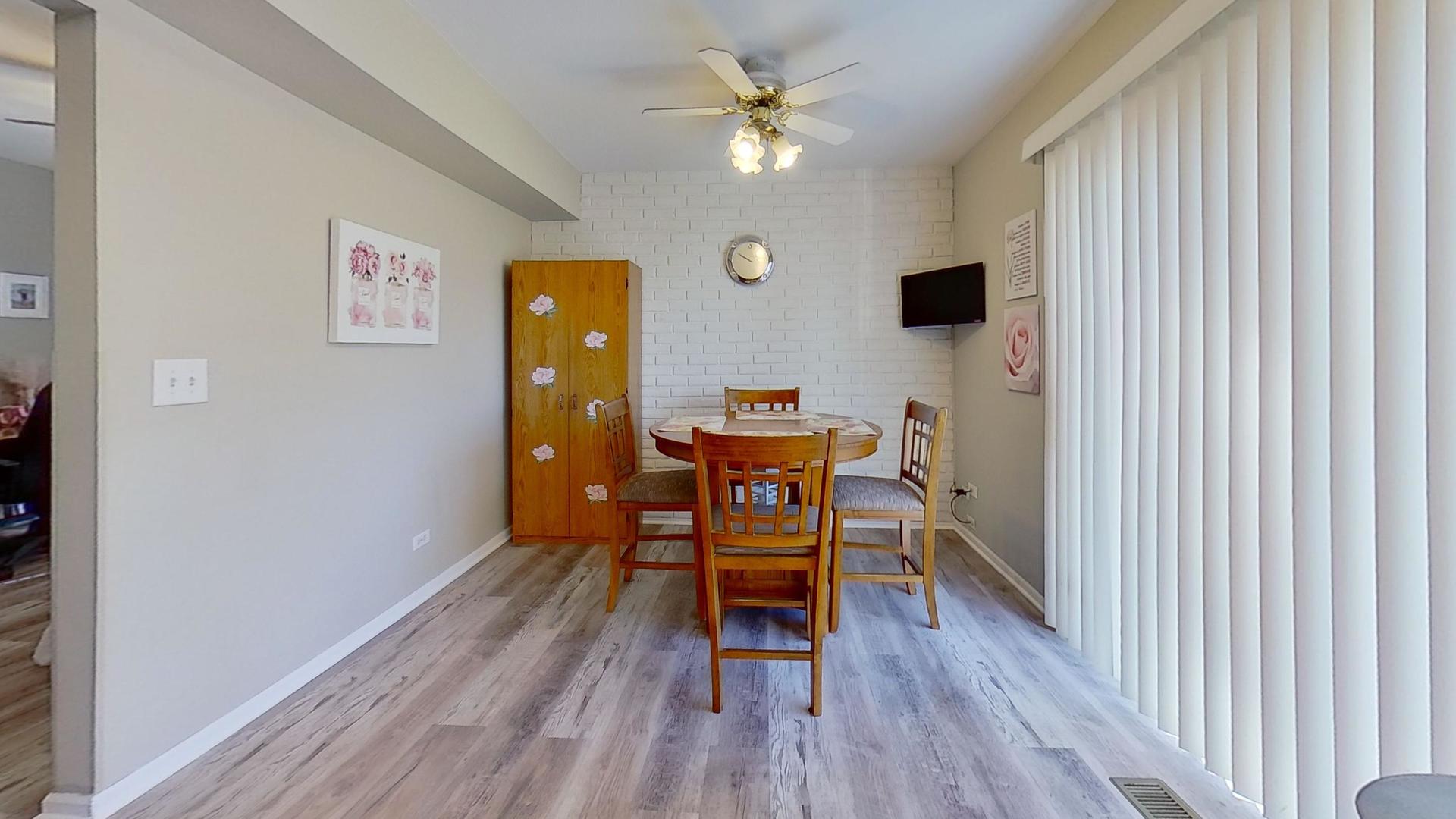 772 Colorado Court, Unit 772 Carol Stream, IL 60188 - Photo 6 of 26 a view of a livingroom with furniture and wooden floor