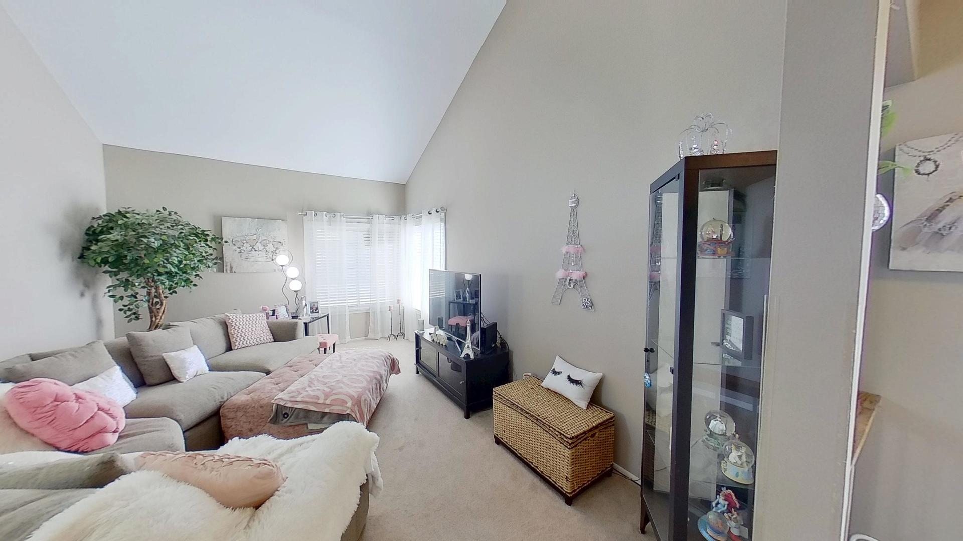 772 Colorado Court, Unit 772 Carol Stream, IL 60188 - Photo 10 of 26 a living room with furniture and a potted plant