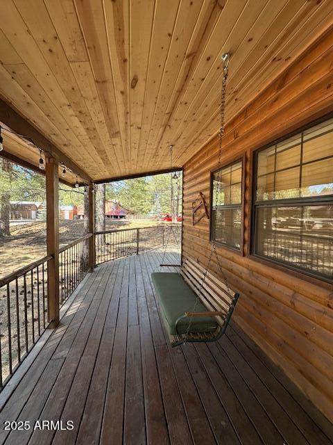207 Blue Ridge Road Mormon Lake, AZ 86038 - Photo 12 of 66 a view of balcony with wooden floor