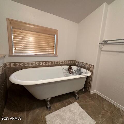 207 Blue Ridge Road Mormon Lake, AZ 86038 - Photo 36 of 66 a bath tub sitting in a bathroom next to a window