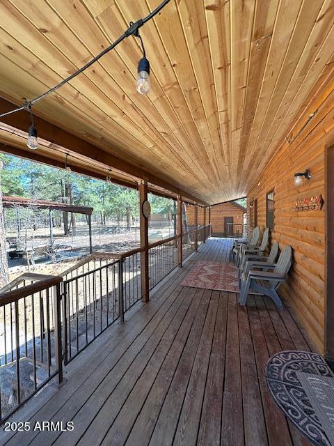 207 Blue Ridge Road Mormon Lake, AZ 86038 - Photo 38 of 66 a view of a balcony with wooden floor