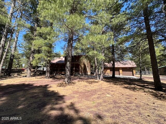 207 Blue Ridge Road Mormon Lake, AZ 86038 - Photo 4 of 66 a view of a house with snow on the ground