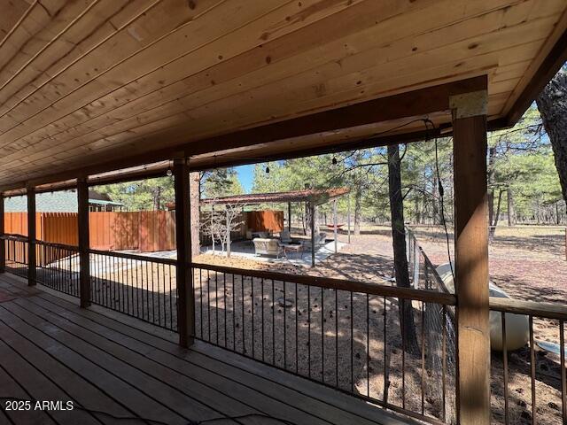 207 Blue Ridge Road Mormon Lake, AZ 86038 - Photo 42 of 66 a view of a porch with wooden floor of the house