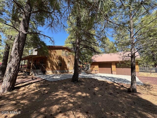 207 Blue Ridge Road Mormon Lake, AZ 86038 - Photo 5 of 66 a view of a house with large tree