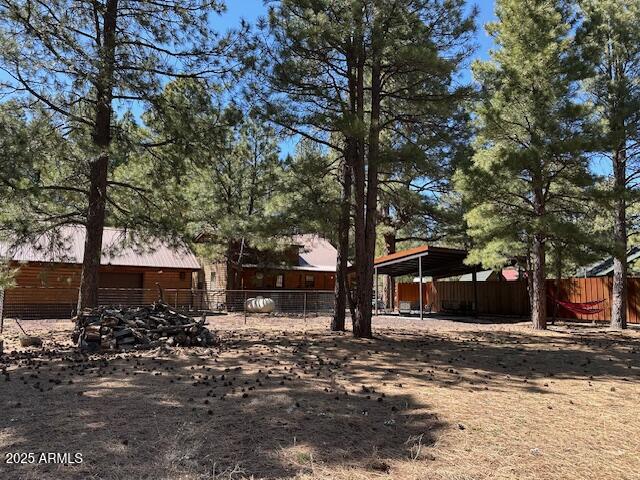 207 Blue Ridge Road Mormon Lake, AZ 86038 - Photo 55 of 66 a front view of a house with a yard
