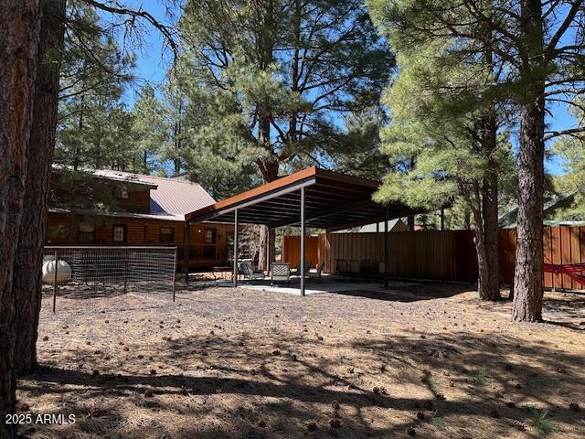 207 Blue Ridge Road Mormon Lake, AZ 86038 - Photo 56 of 66 a view of a backyard with large trees