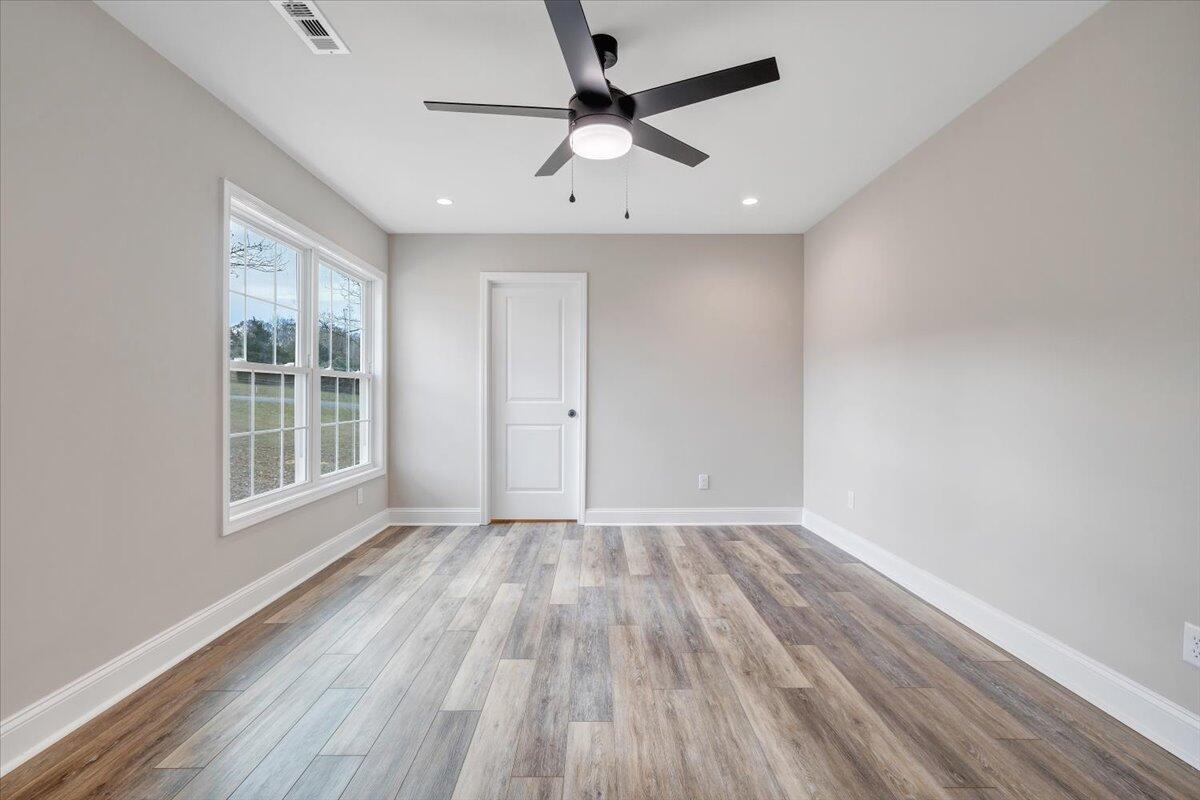 149 Windlass Road Moneta, VA 24121 - Photo 18 of 44 wooden floor in an empty room with a window