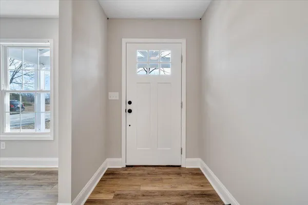a view of kitchen with wooden floor