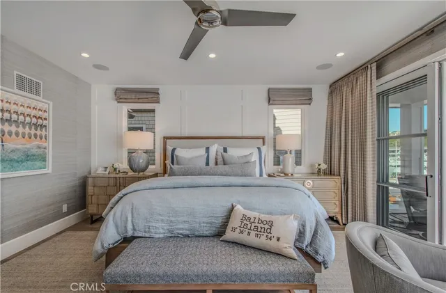 a living room with furniture and a large mirror