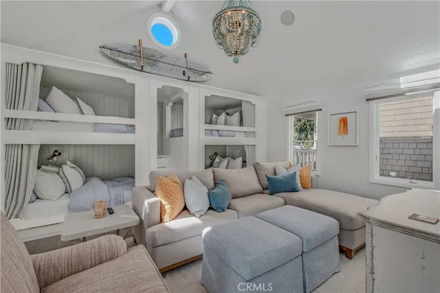 a living room with furniture a table and a potted plant