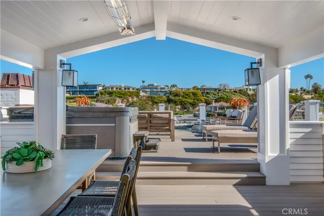 a living room with furniture a rug and a table