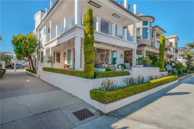 a view of an buildings with small garden and plants