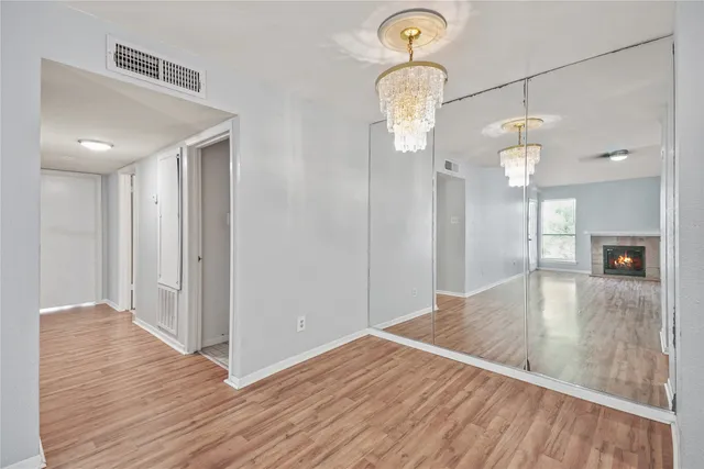 a view of a room with wooden floor and staircase