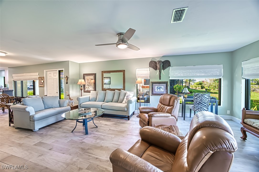 1683 Bent Tree Circle Fort Myers, FL 33907 - Photo 19 of 48 a living room with furniture and a large window