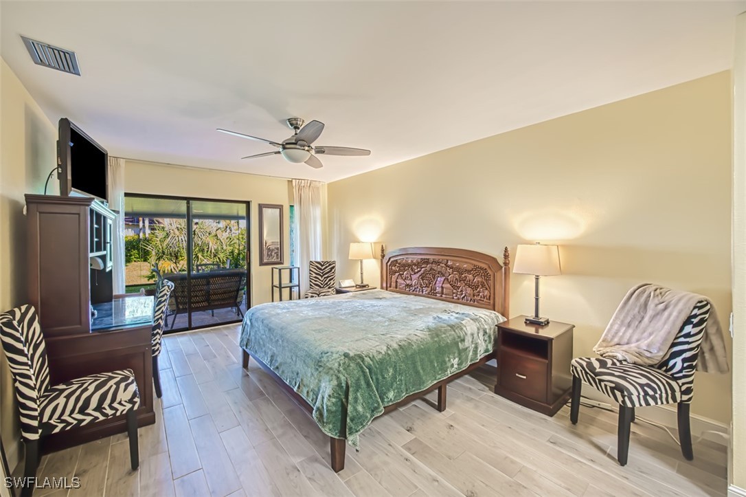1683 Bent Tree Circle Fort Myers, FL 33907 - Photo 23 of 48 a bedroom with a bed and a couch