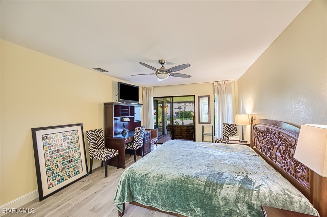 1683 Bent Tree Circle Fort Myers, FL 33907 - Photo 28 of 48 a bed room with a bed and a tv
