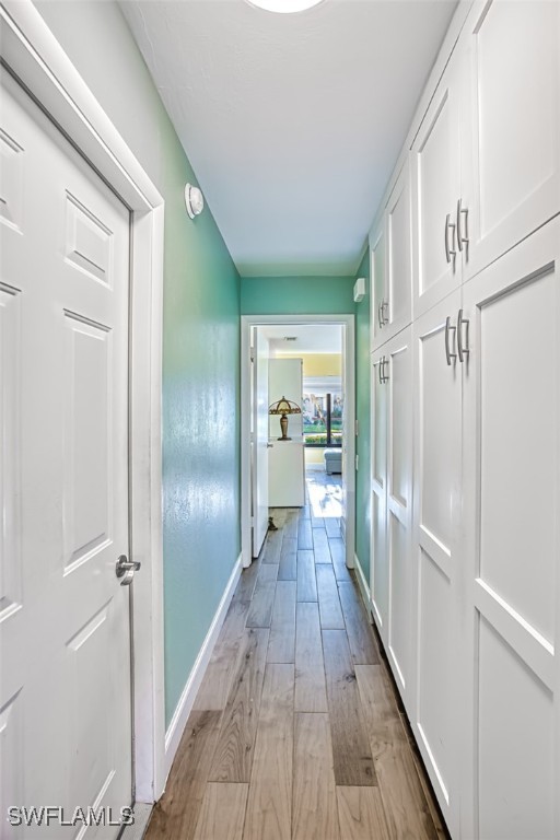 1683 Bent Tree Circle Fort Myers, FL 33907 - Photo 29 of 48 a view of a hallway with wooden floor cabinets and staircase