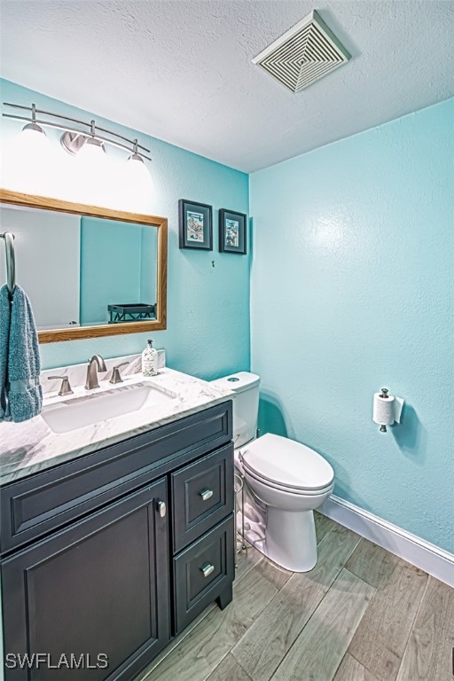 1683 Bent Tree Circle Fort Myers, FL 33907 - Photo 36 of 48 a bathroom with a granite countertop toilet sink and mirror