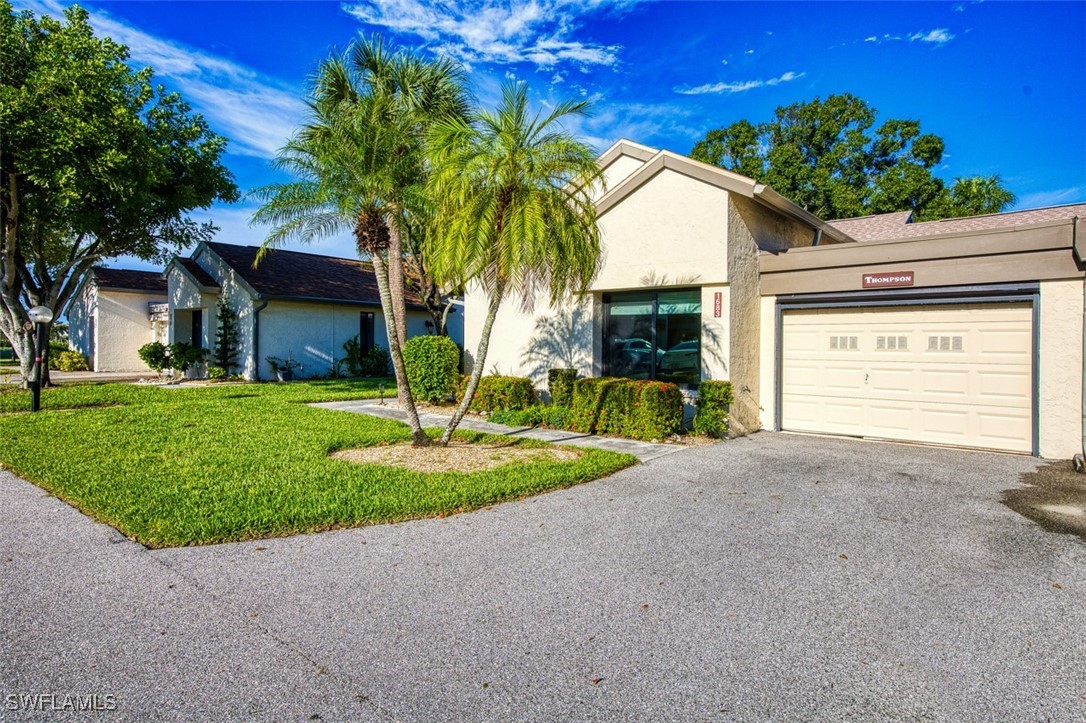 1683 Bent Tree Circle Fort Myers, FL 33907 - Photo 4 of 48 a front view of house with yard and green space