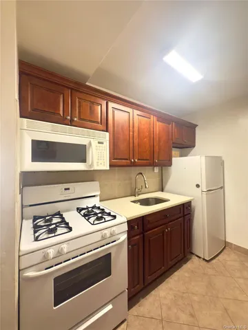 a kitchen with a stove and a refrigerator