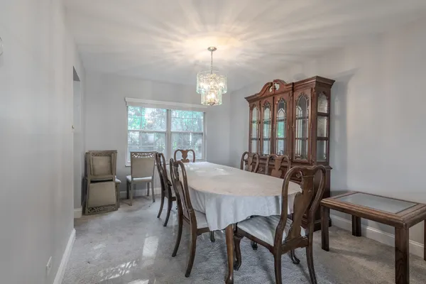 a view of a dining room with furniture and window