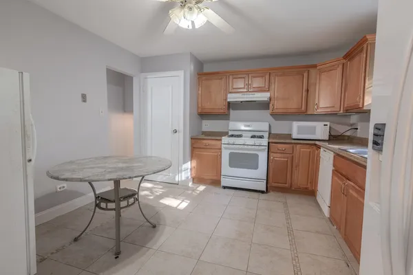 a kitchen with stainless steel appliances a stove a sink dishwasher and a refrigerator