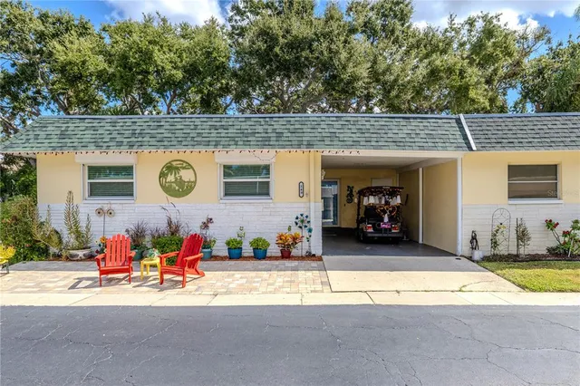 a group of people sitting in front of a building