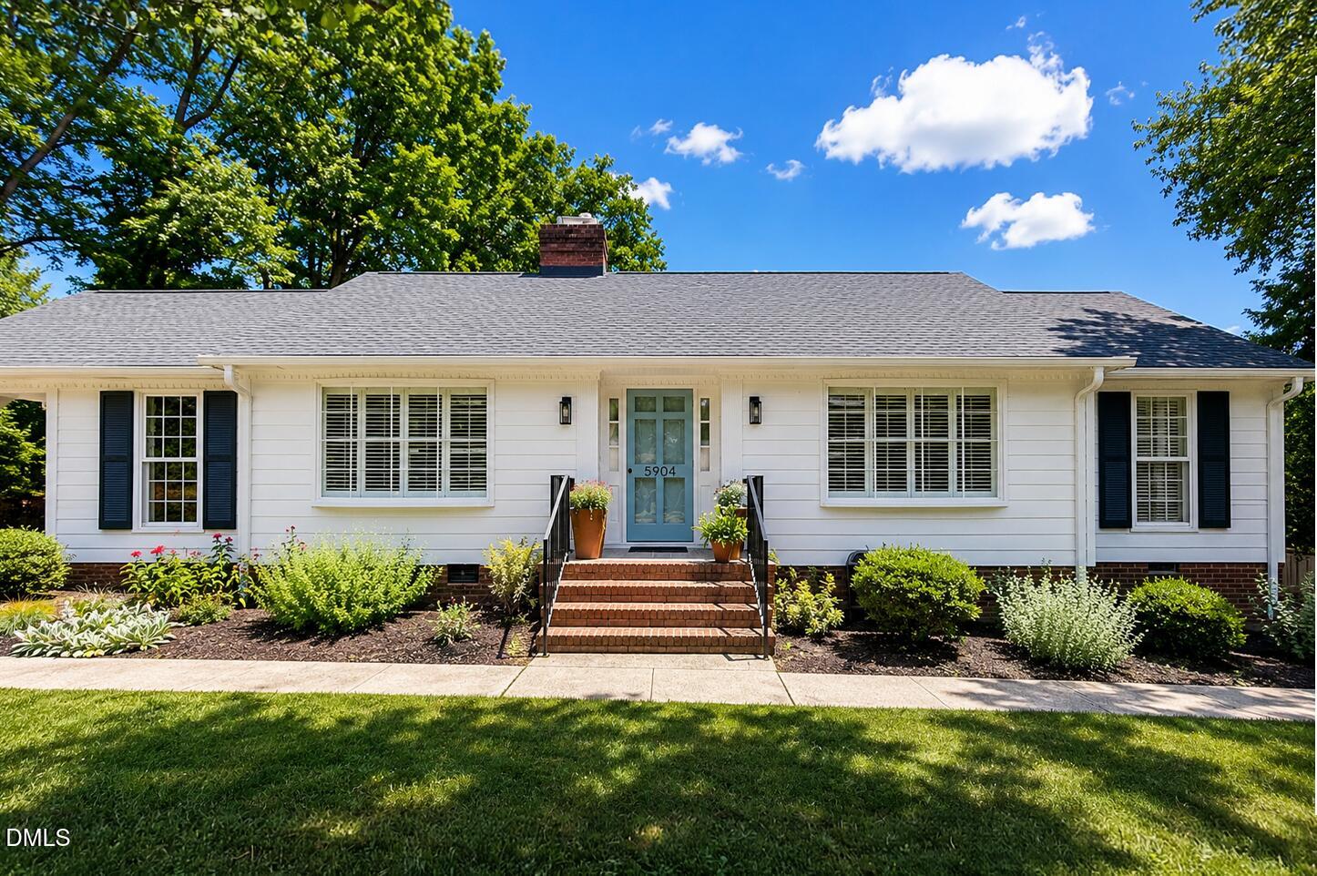 5904 Volant Drive Raleigh, NC 27609 - Photo 1 of 42 a front view of a house with a yard
