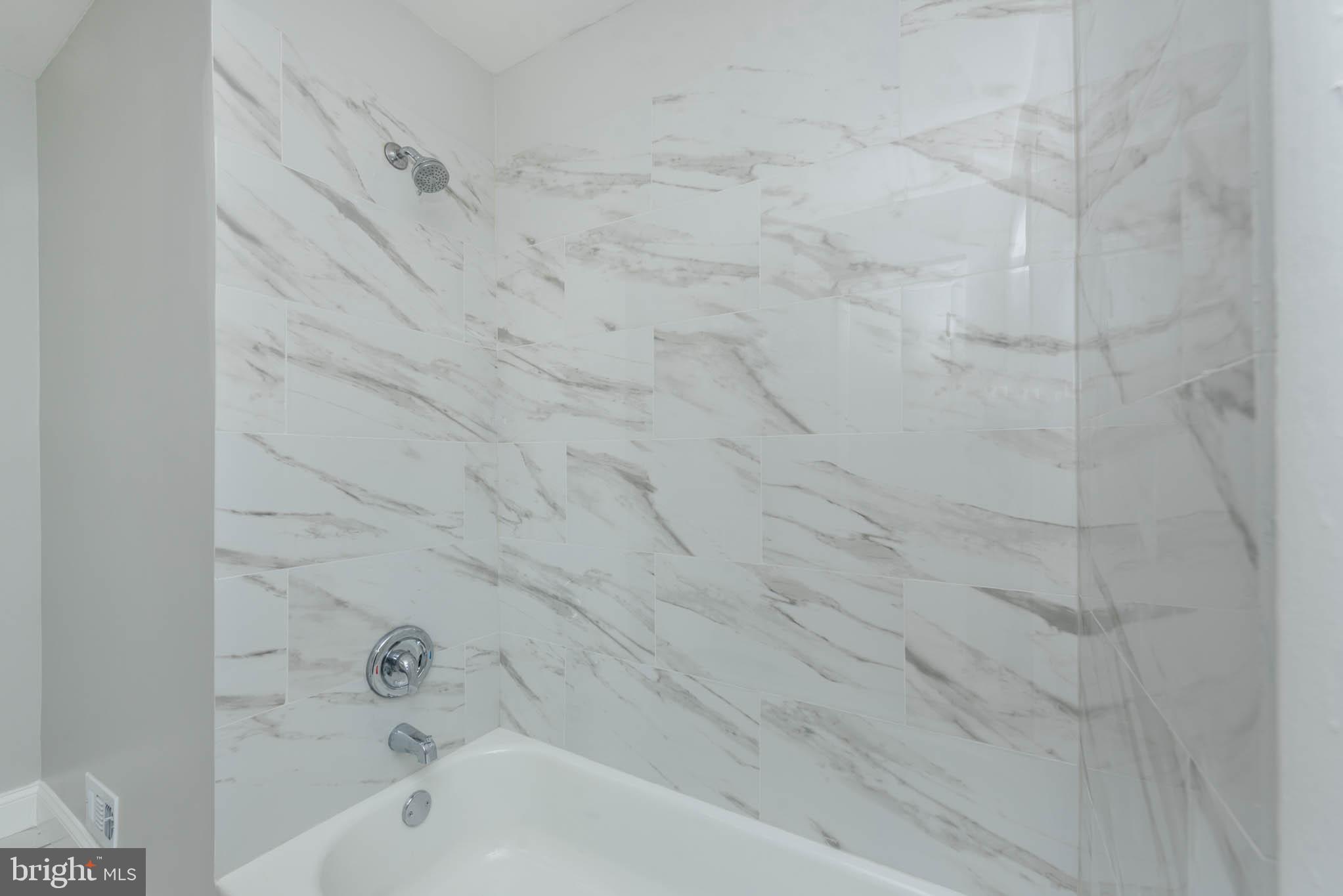 5611 Force Road Baltimore, MD 21206 - Photo 13 of 21 a bathroom with a bathtub