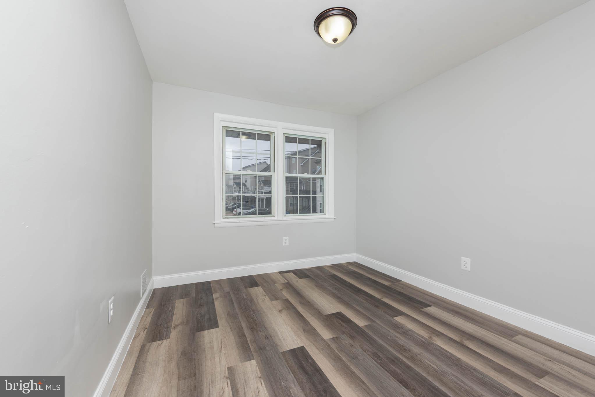 5611 Force Road Baltimore, MD 21206 - Photo 17 of 21 an empty room with a window
