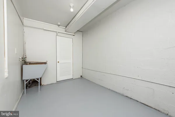 a view of a room with wooden floor and closet
