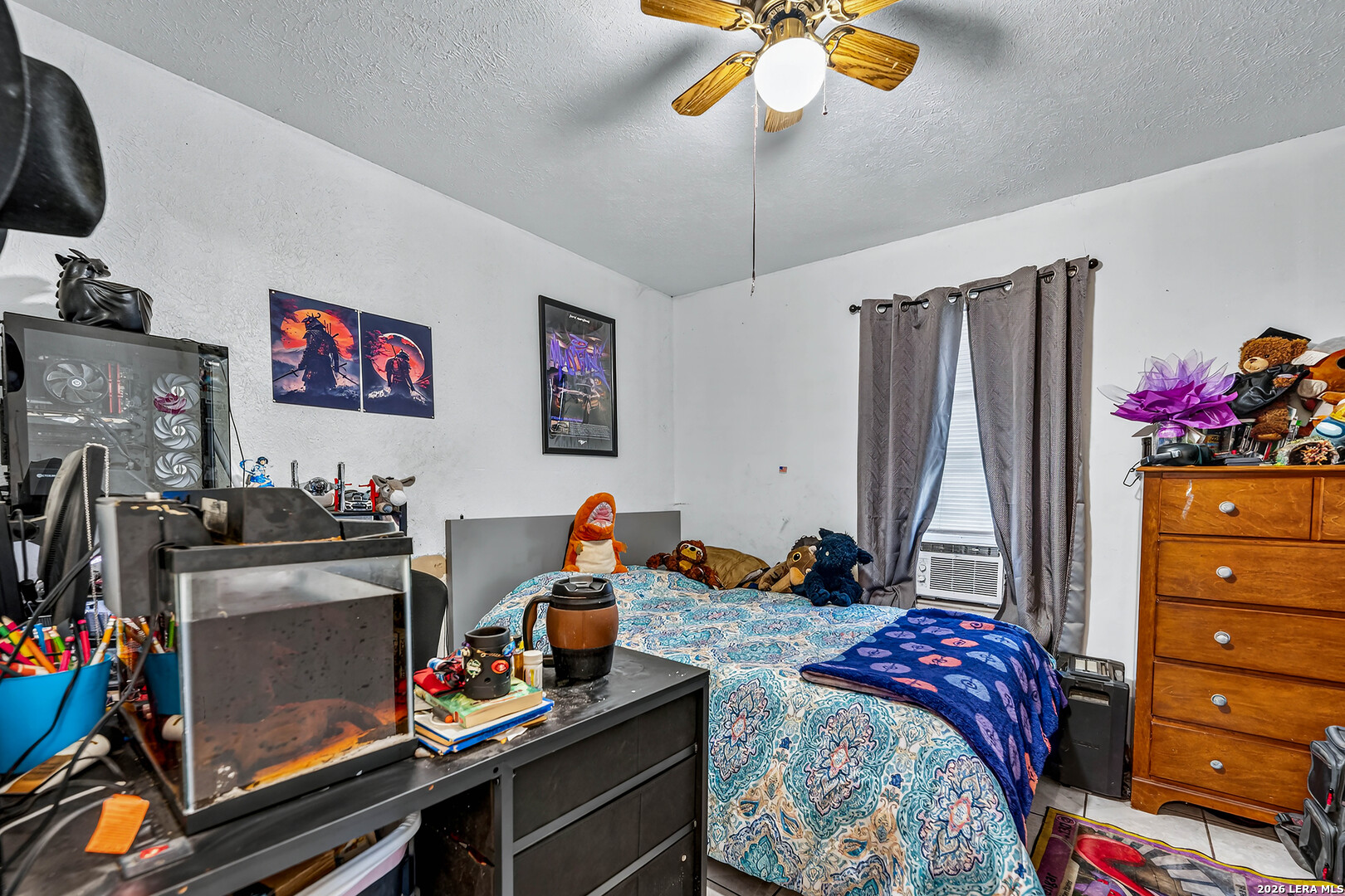 903 East Westmeyer Street Poth, TX 78147 - Photo 12 of 23 a bedroom with a bed and a chandelier