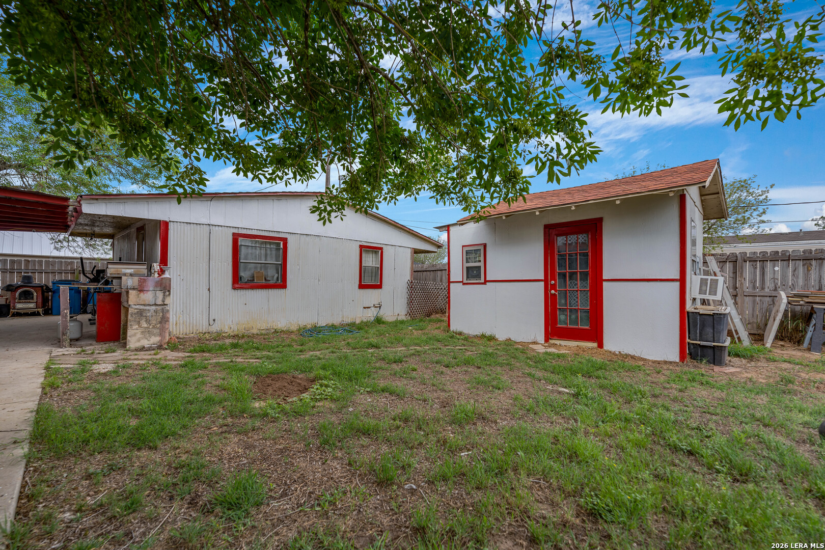 903 East Westmeyer Street Poth, TX 78147 - Photo 18 of 23 a front view of house with yard and trees in the background