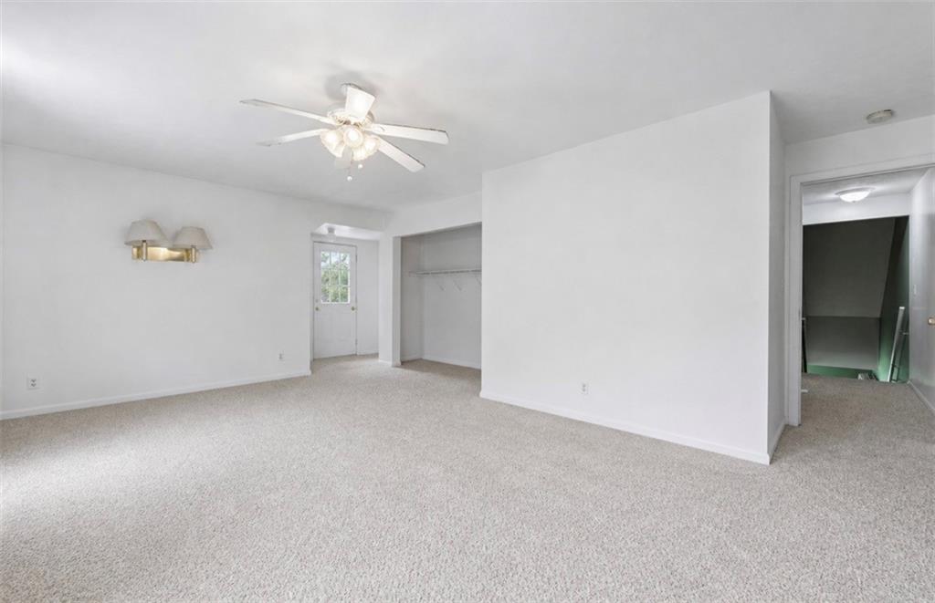 331 Hill Road Georgetown, PA 15043 - Photo 19 of 33 an empty room with chandelier fan and windows