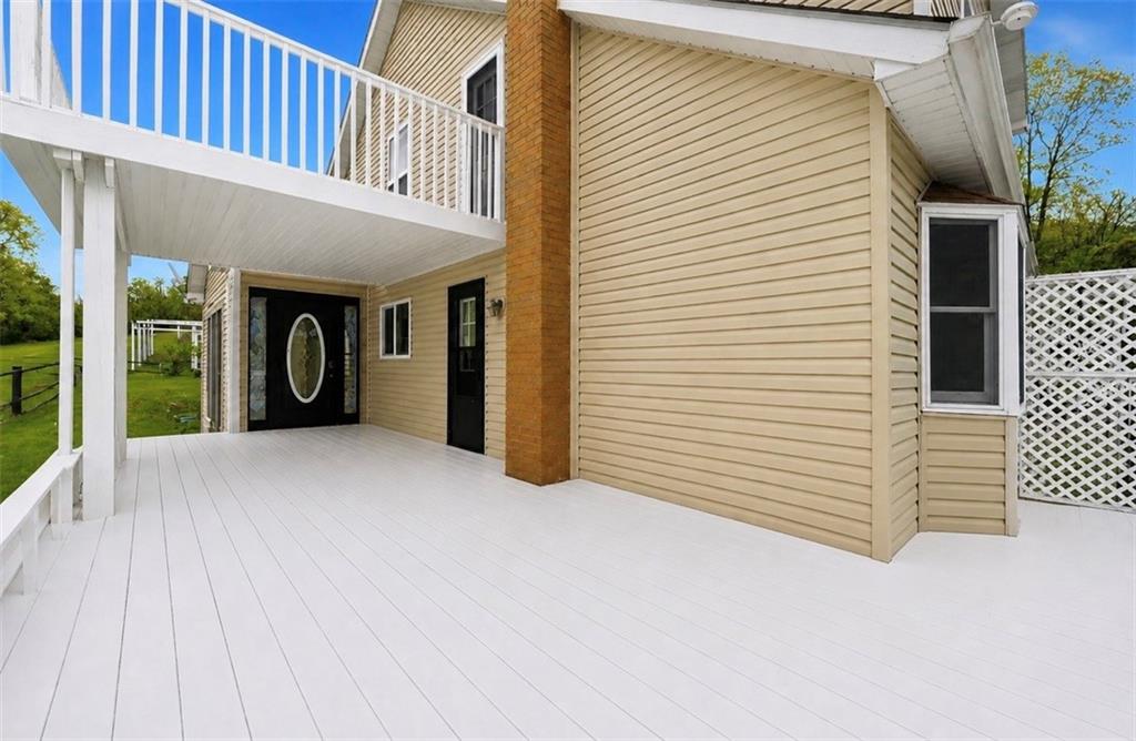 331 Hill Road Georgetown, PA 15043 - Photo 28 of 33 a view of a porch with wooden floor and a yard