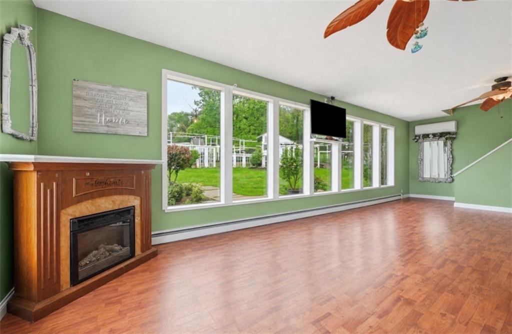 331 Hill Road Georgetown, PA 15043 - Photo 4 of 33 a view of an empty room with window and fire place