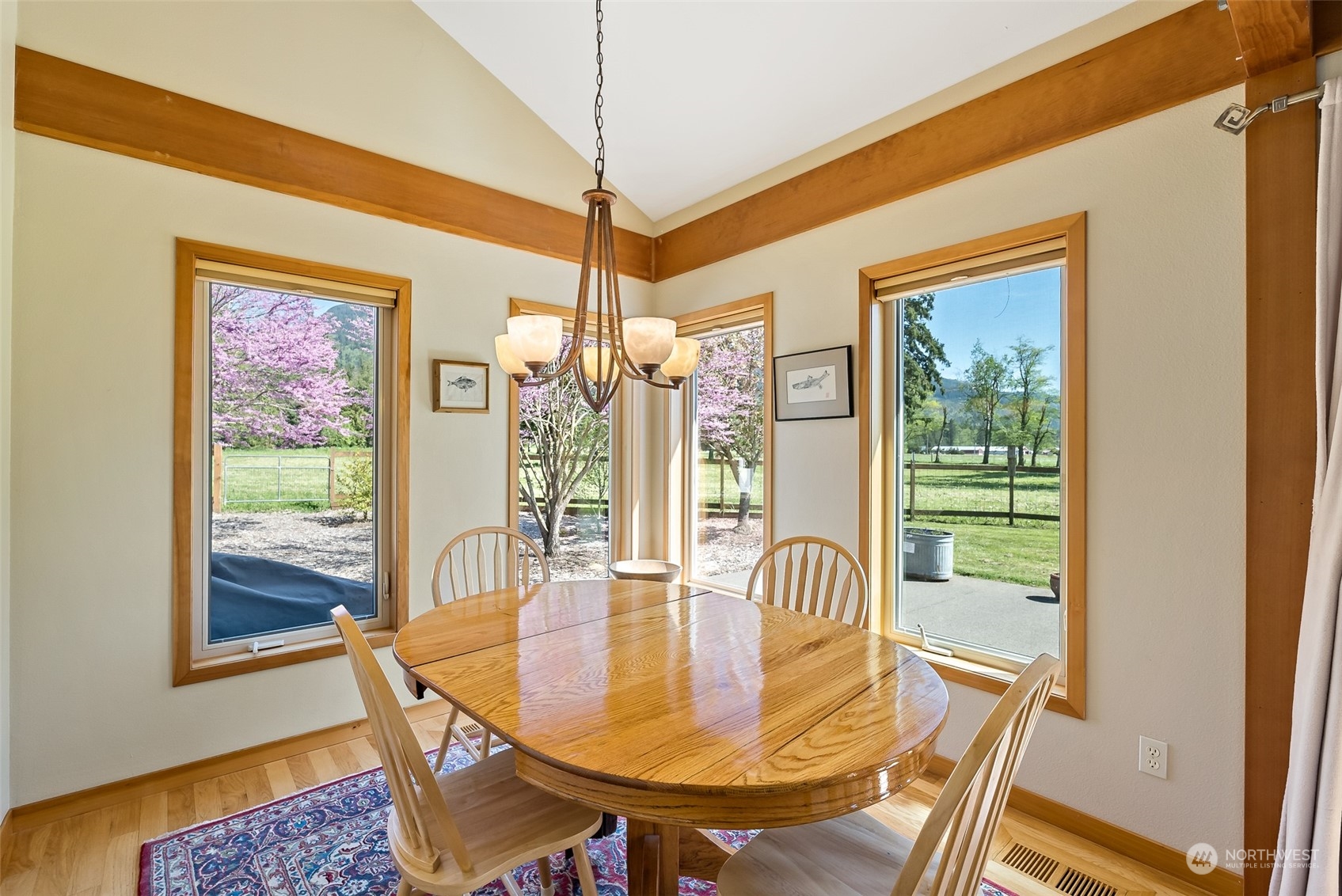 7901 Leibrant Road Everson, WA 98247 - Photo 8 of 39 a dining room with furniture a chandelier and wooden floor