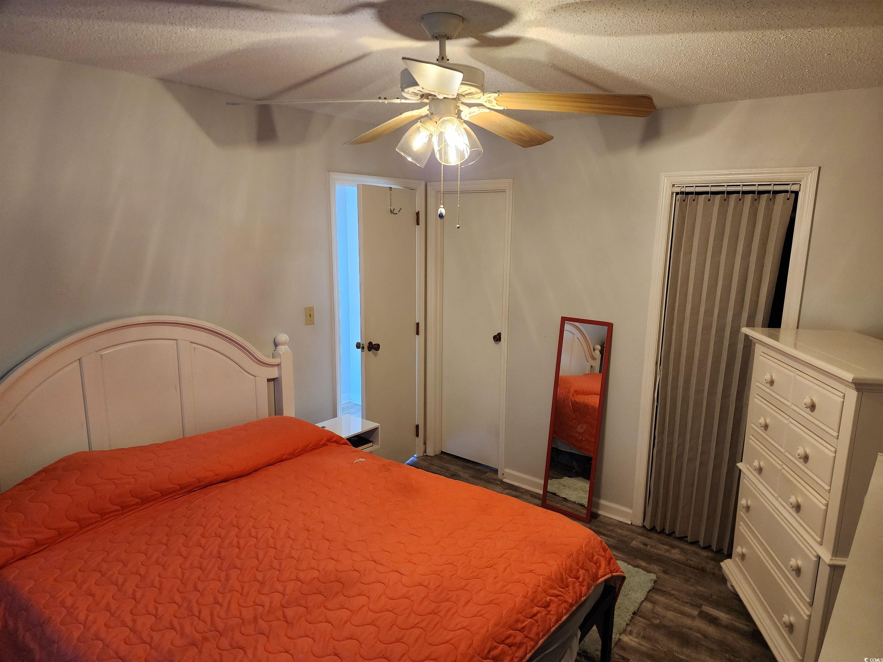 1870 Auburn Lane Surfside Beach, SC 29575 - Photo 12 of 18 Bedroom with a textured ceiling, ceiling fan, and
