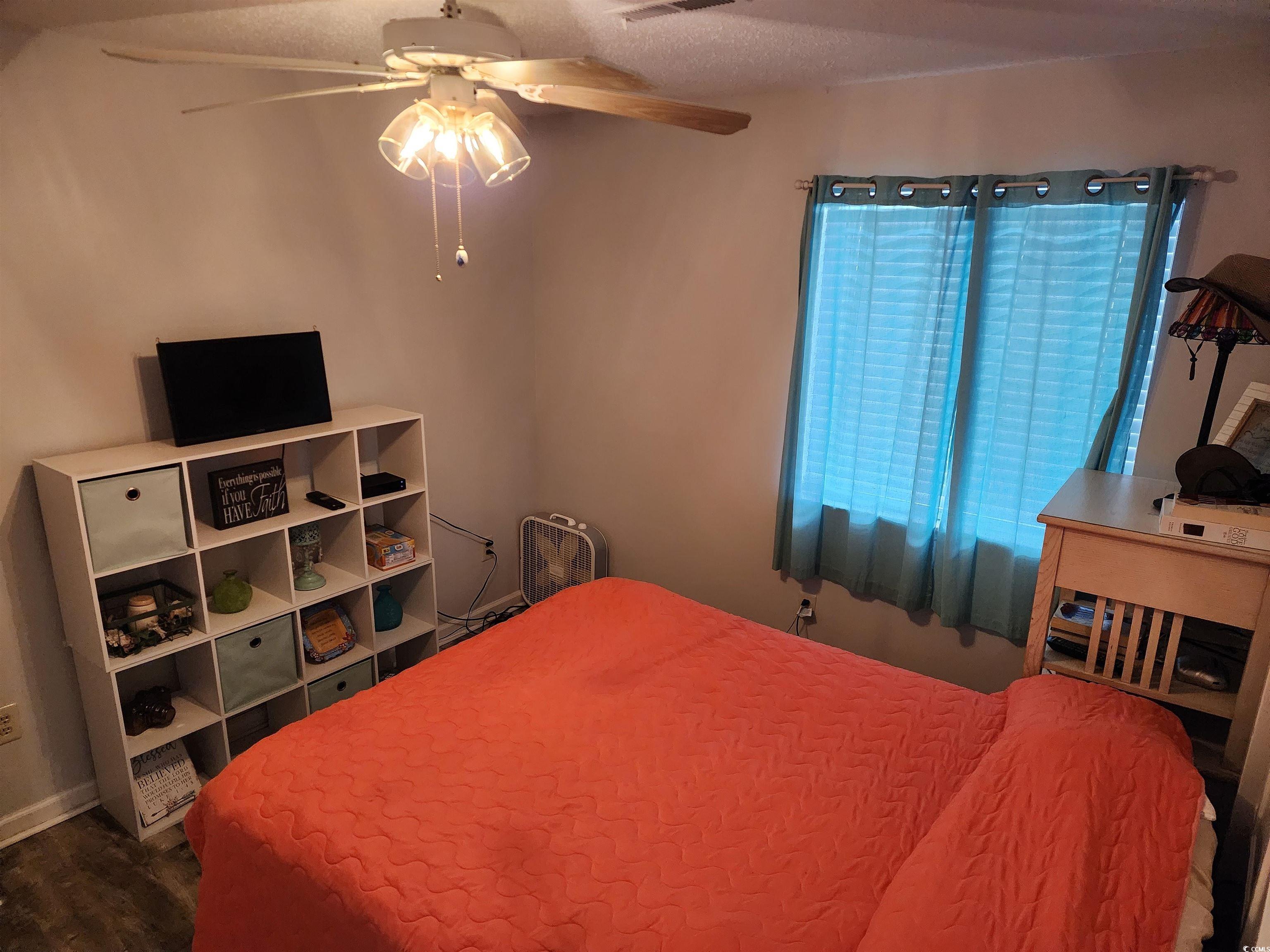 1870 Auburn Lane Surfside Beach, SC 29575 - Photo 13 of 18 Bedroom with ceiling fan and wood-type flooring