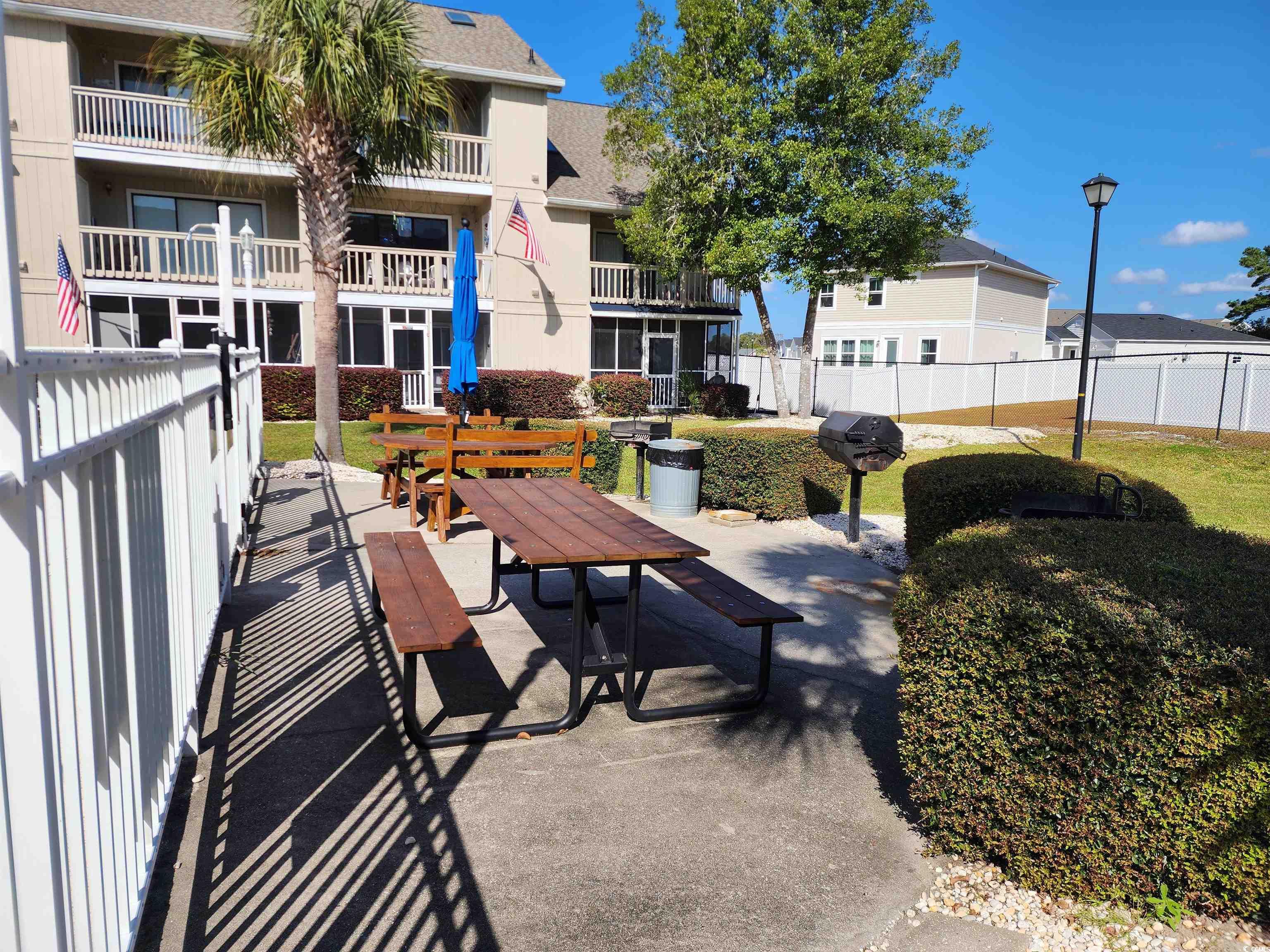 1870 Auburn Lane Surfside Beach, SC 29575 - Photo 16 of 18 View of home's community featuring a patio